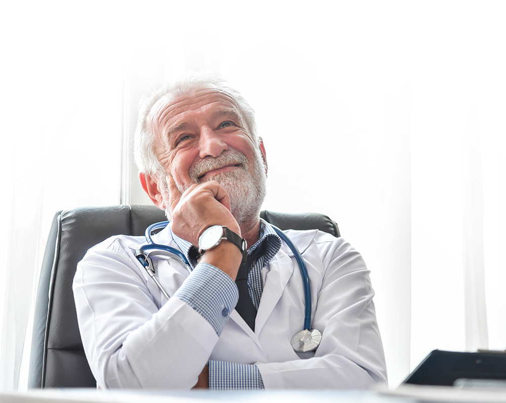 Happy Senior male Doctor is thinking.